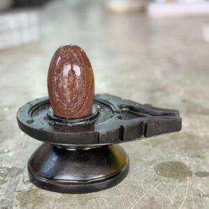 Narmadeshwar Shivling with Black Yoni Base (Natural Earth-Tone Stone)