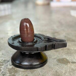 Narmadeshwar Shivling with Black Yoni Base (Natural Layered Brown Stone)